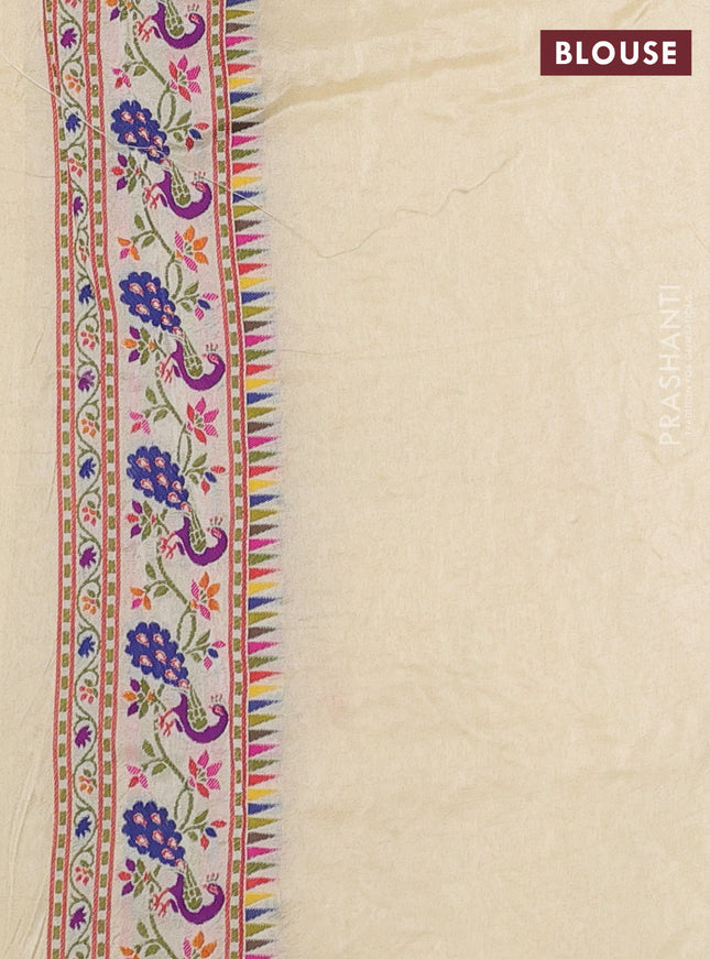 Dola silk saree cream with allover jamdhani thread weaves and peacock design thread woven border