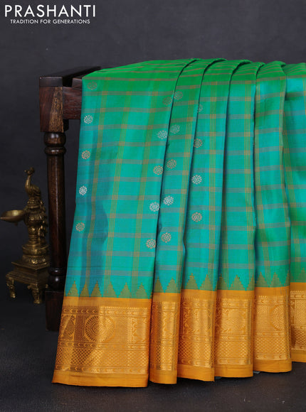 Pure gadwal silk saree teal bluish green and dark mustard with allover checks & zari buttas and temple design zari woven border