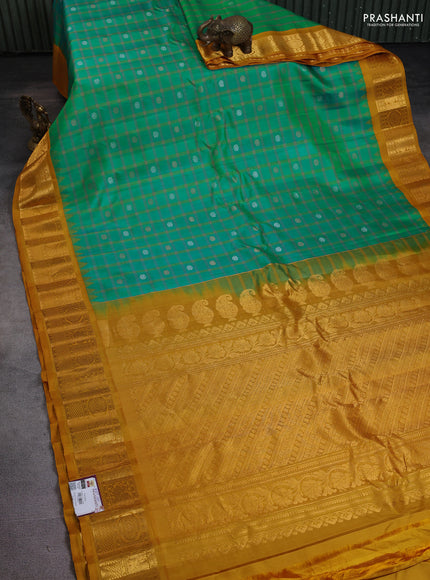Pure gadwal silk saree teal bluish green and dark mustard with allover checks & zari buttas and temple design zari woven border
