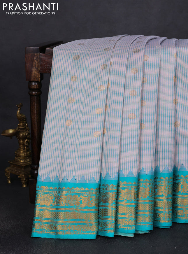 Pure gadwal silk saree cream and teal blue with allover small checks & zari buttas and temple design zari woven border