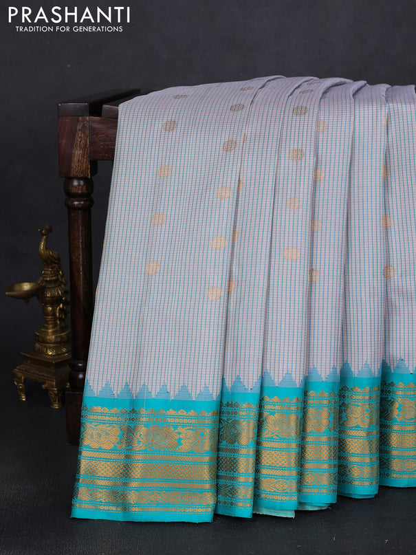 Pure gadwal silk saree cream and teal blue with allover small checks & zari buttas and temple design zari woven border