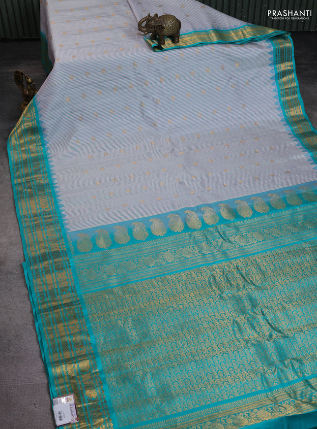 Pure gadwal silk saree cream and teal blue with allover small checks & zari buttas and temple design zari woven border
