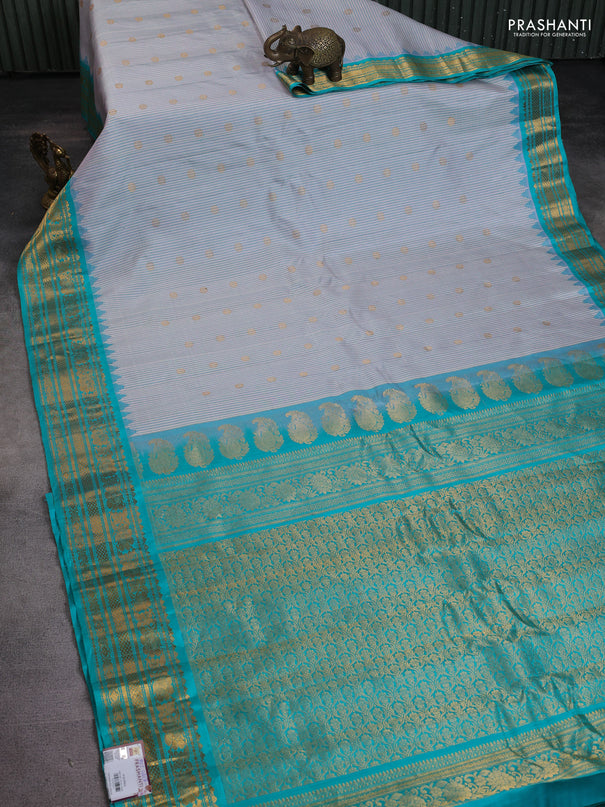 Pure gadwal silk saree cream and teal blue with allover small checks & zari buttas and temple design zari woven border