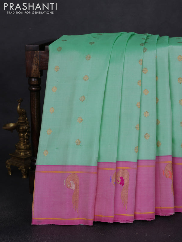 Pure gadwal silk saree teal green shade and pink with zari woven buttas and zari woven peacock butta border