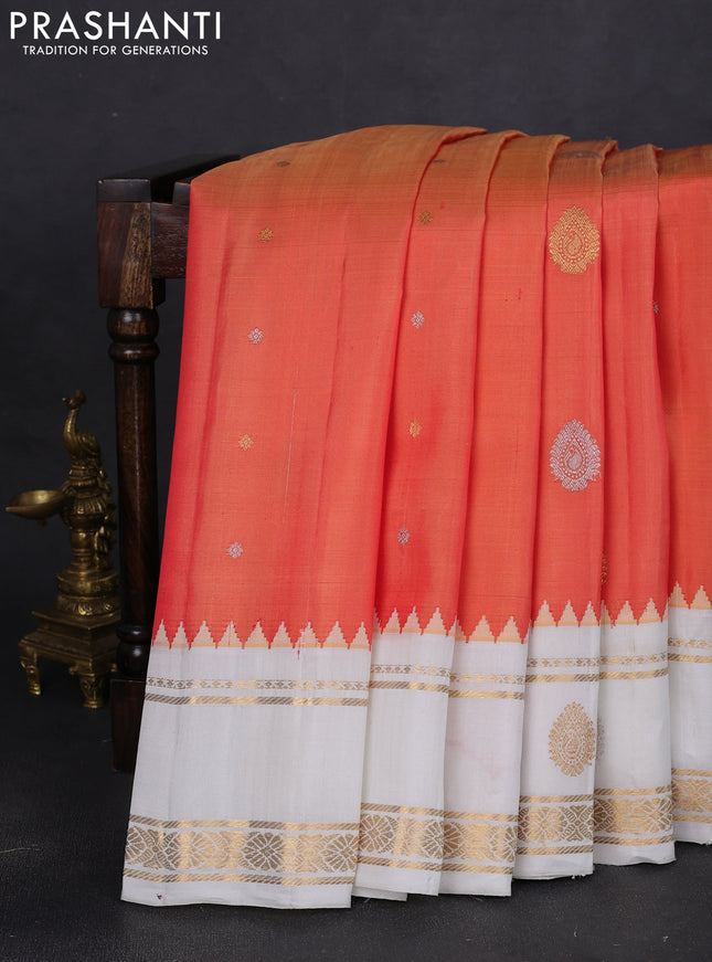 Pure gadwal silk saree dual shade of pinkish peach orange and off white with silver & gold zari woven buttas and temple design rettapet zari woven butta border