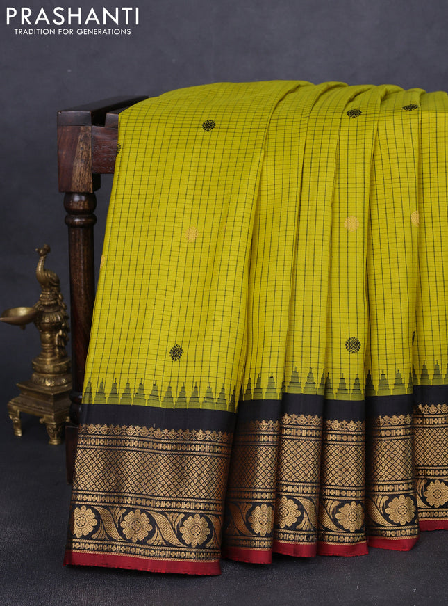 Pure gadwal silk saree yellow and black with allover checks & buttas and temple design zari woven border