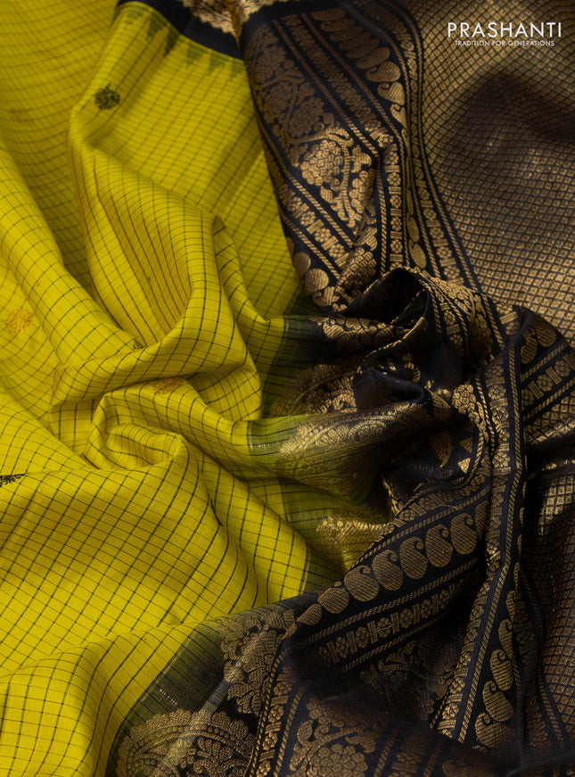 Pure gadwal silk saree yellow and black with allover checks & buttas and temple design zari woven border