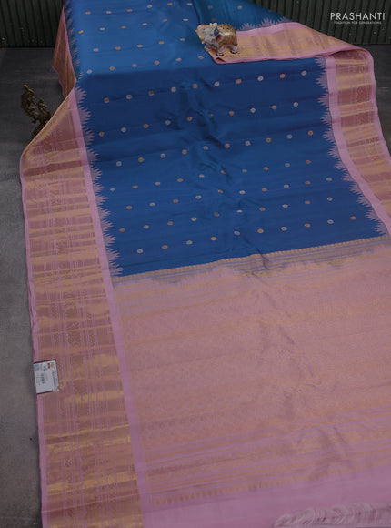 Pure gadwal silk saree dual shade of bluish green and light pink with silver & gold zari woven buttas and temple design zari woven border