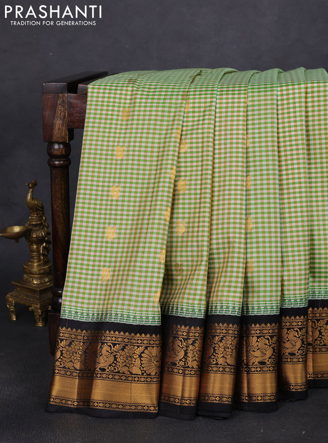 Pure gadwal silk saree multi colour and green black with allover small checks & zari buttas and temple design zari woven border