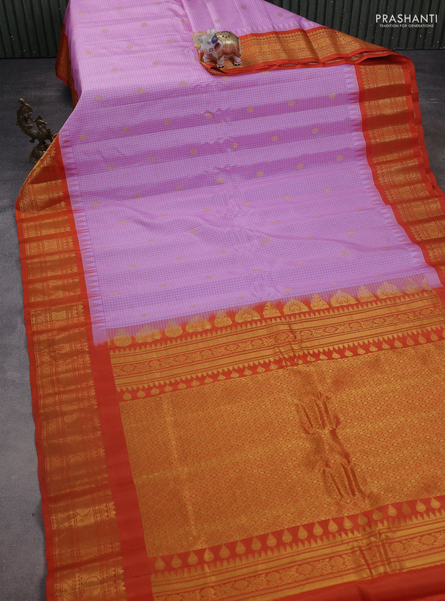 Pure gadwal silk saree mild lavender and rustic orange with allover small checks & zari buttas and temple design zari woven border