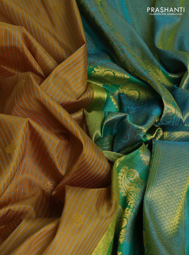 Pure gadwal silk saree dark mustard and teal green with allover checks & zari buttas and temple design zari woven border
