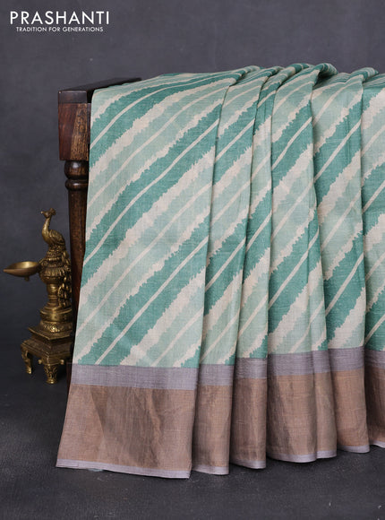 Pure tussar saree green and grey shade with allover leheriya prints and zari woven border