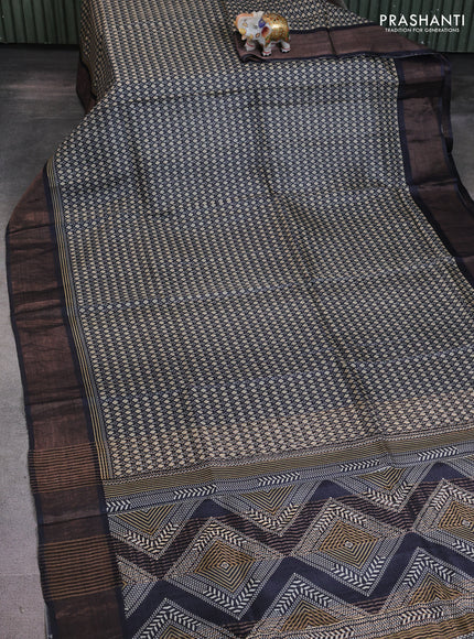 Pure tussar saree black with allover prints and zari woven border