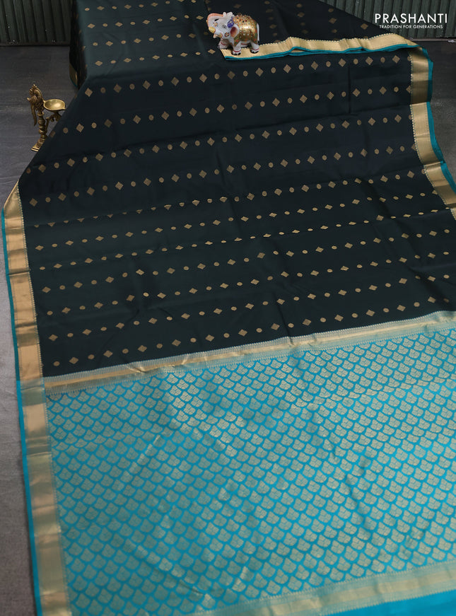 Pure kanchipuram silk saree bottle green and teal green shade with allover zari woven buttas and rich zari woven border