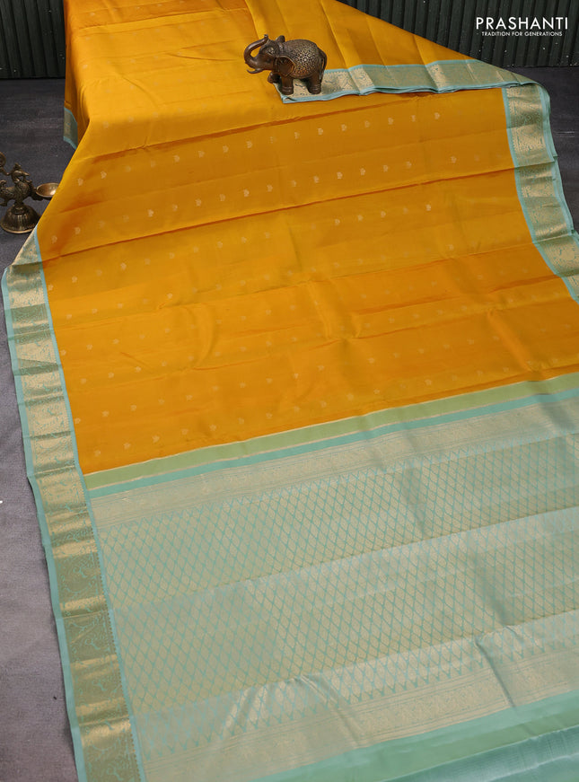 Pure kanchipuram silk saree yellow and pastel green with zari woven buttas and rich zari woven korvai border