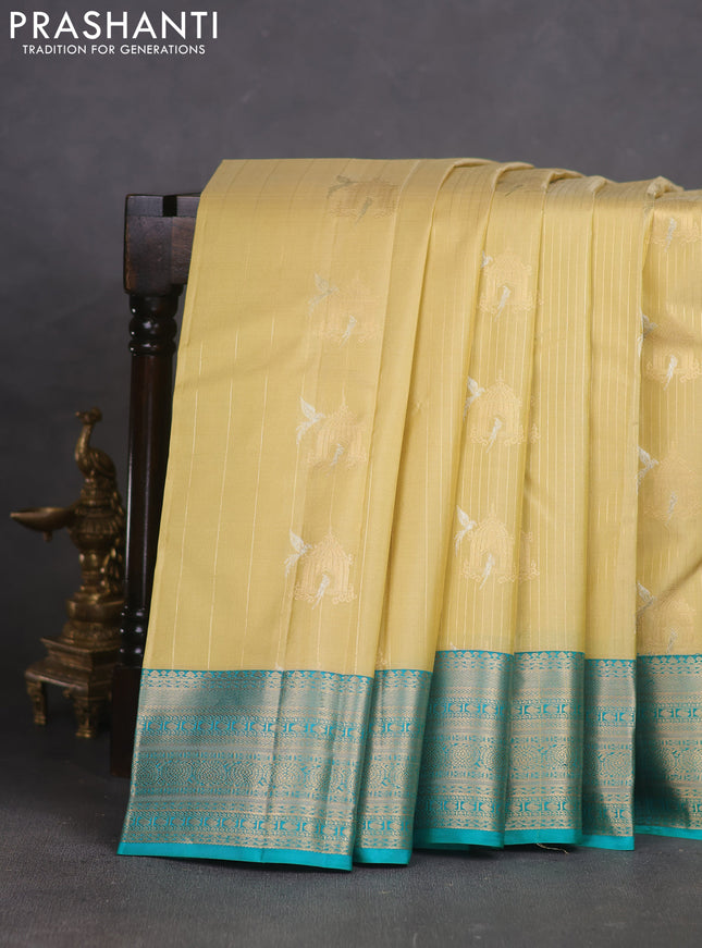 Pure kanchipuram silk saree cream and teal green with allover zari weaves & buttas and zari woven korvai border