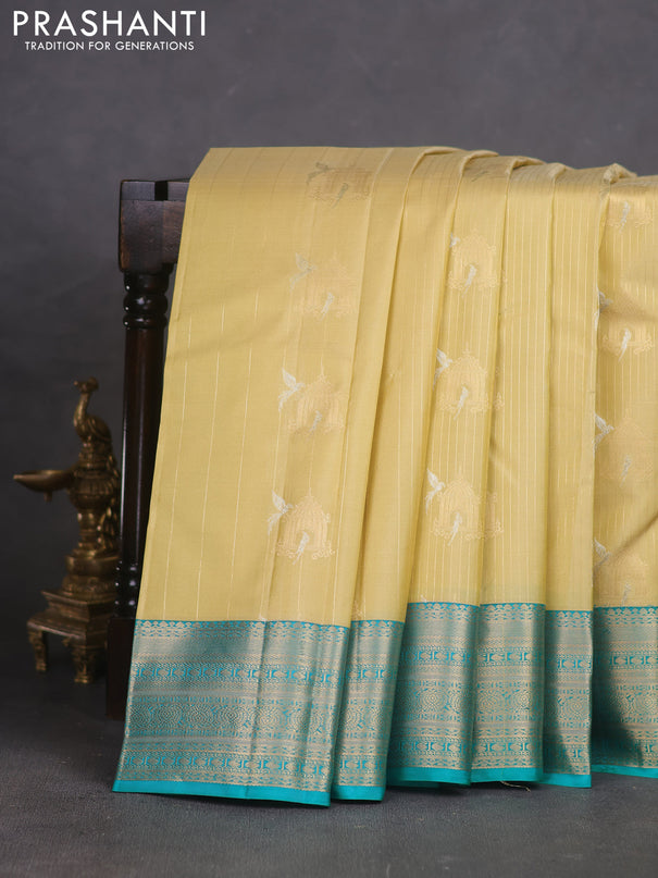 Pure kanchipuram silk saree cream and teal green with allover zari weaves & buttas and zari woven korvai border