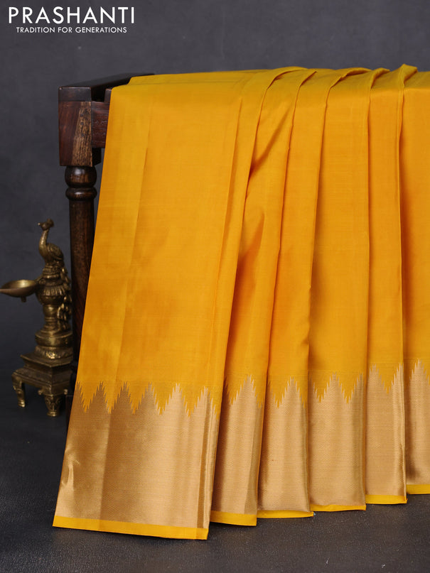 Pure kanchipuram silk saree yellow with plain body and rich temple zari woven border
