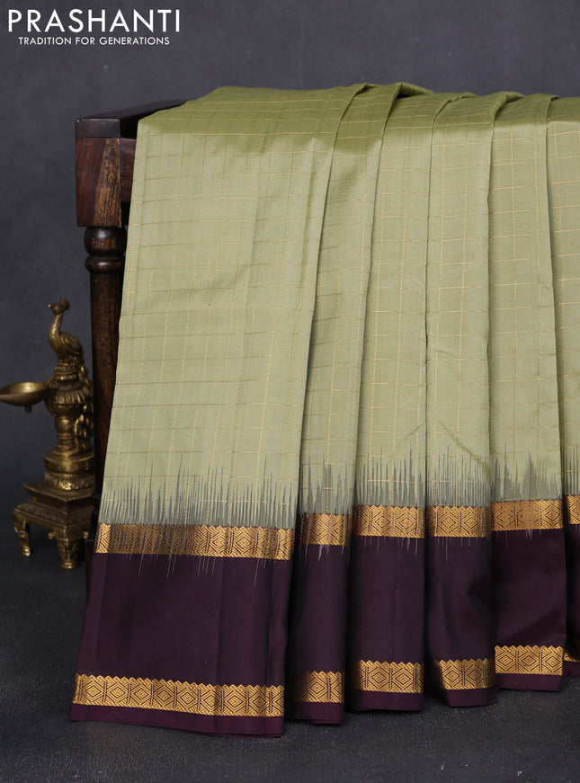 Pure kanchipuram silk saree pastel green and wine shade with allover checked pattern and rettapet zari woven border