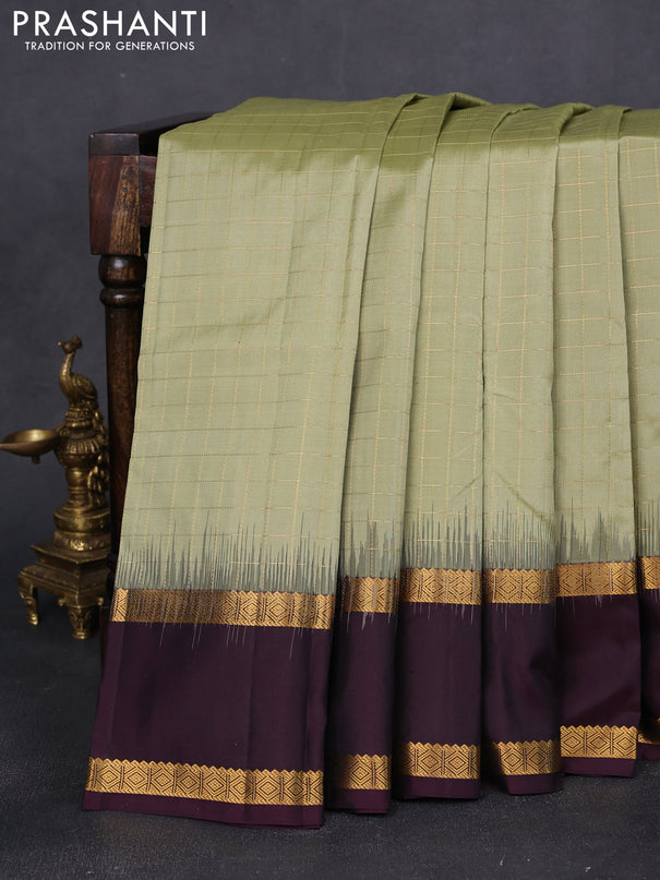 Pure kanchipuram silk saree pastel green and wine shade with allover checked pattern and rettapet zari woven border