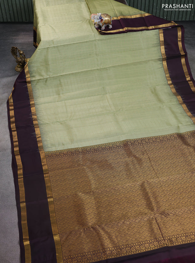 Pure kanchipuram silk saree pastel green and wine shade with allover checked pattern and rettapet zari woven border