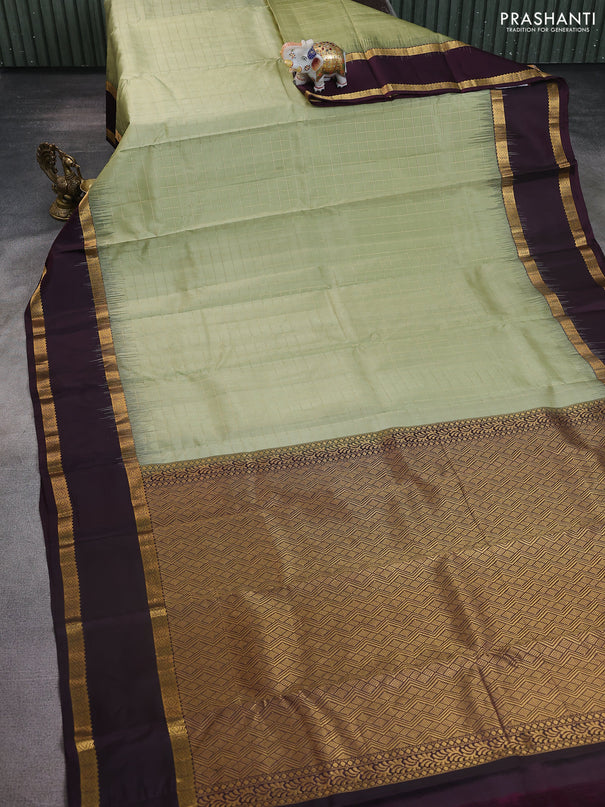 Pure kanchipuram silk saree pastel green and wine shade with allover checked pattern and rettapet zari woven border