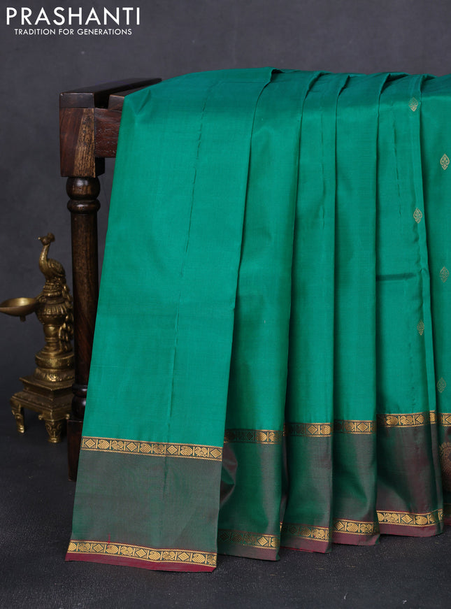 Pure kanchipuram silk saree green and dual shade of purple with zari woven buttas and rettapet zari woven paisley butta border
