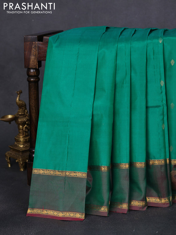 Pure kanchipuram silk saree green and dual shade of purple with zari woven buttas and rettapet zari woven paisley butta border