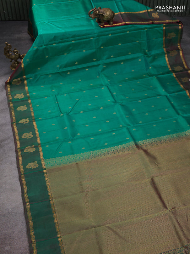 Pure kanchipuram silk saree green and dual shade of purple with zari woven buttas and rettapet zari woven paisley butta border