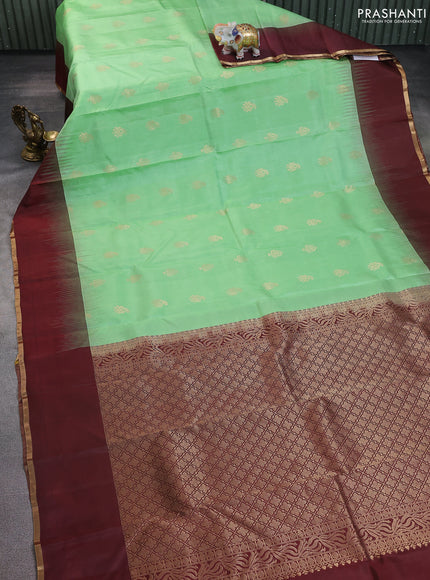 Pure kanchipuram silk saree pista green and wine shade with zari woven buttas and simple zari woven border