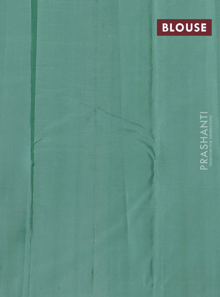 Pure kanchipuram silk saree navy blue and pastel green with zari woven buttas and zari woven butta border