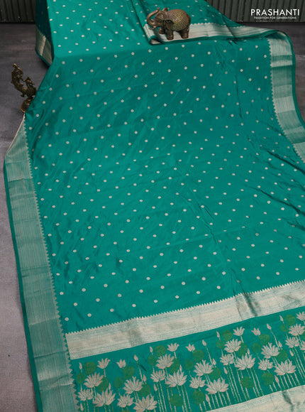 Semi raw silk saree teal green with allover zari woven buttas and zari woven border