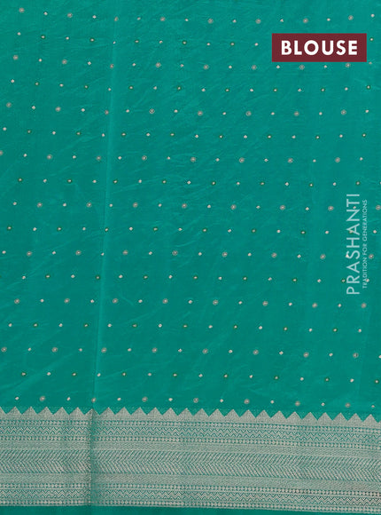 Semi raw silk saree teal green with allover zari woven buttas and zari woven border