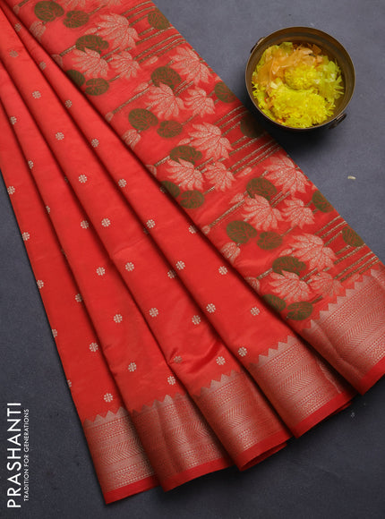 Semi raw silk saree orange with allover zari woven buttas and zari woven border