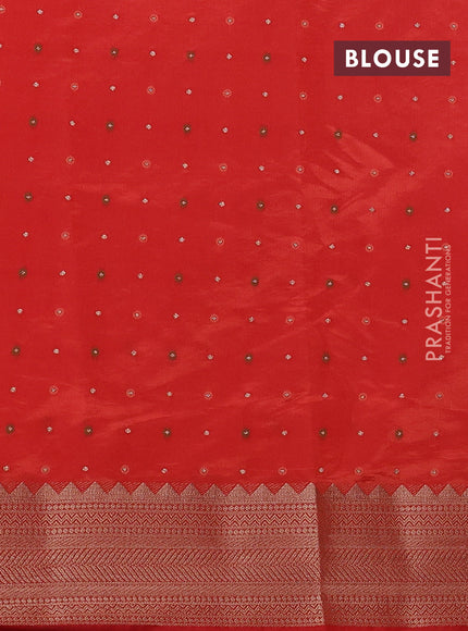 Semi raw silk saree orange with allover zari woven buttas and zari woven border