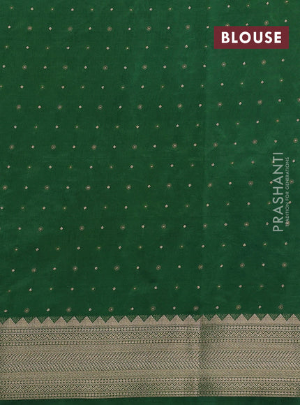 Semi raw silk saree green with allover zari woven buttas and zari woven border