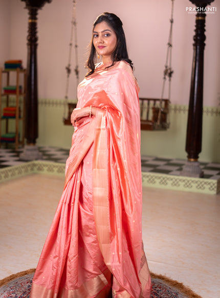 Semi raw silk saree orange with allover zari woven buttas and zari woven border
