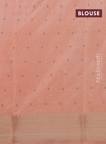 Semi raw silk saree orange with allover zari woven buttas and zari woven border