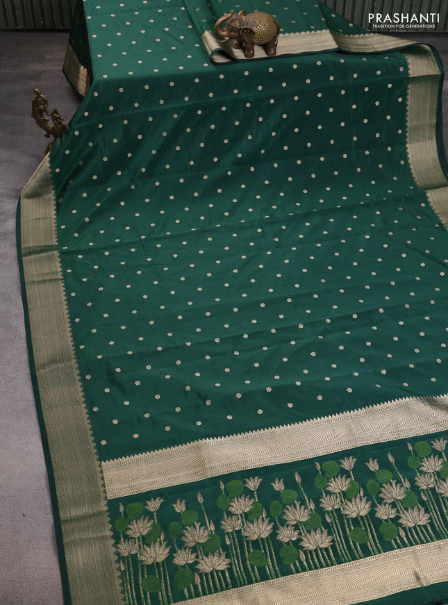 Semi raw silk saree green with allover zari woven buttas and zari woven border