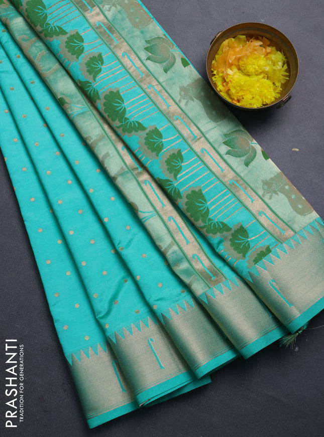 Semi raw silk saree teal green with allover zari woven buttas and pichwai design pallu