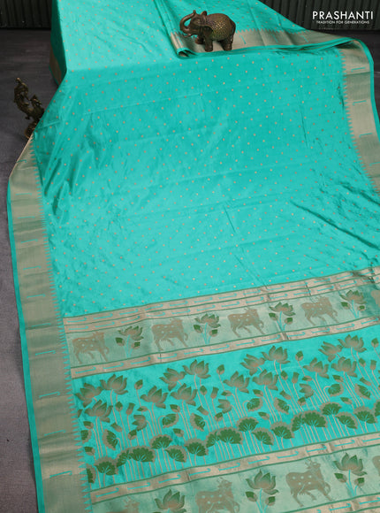 Semi raw silk saree teal green with allover zari woven buttas and pichwai design pallu