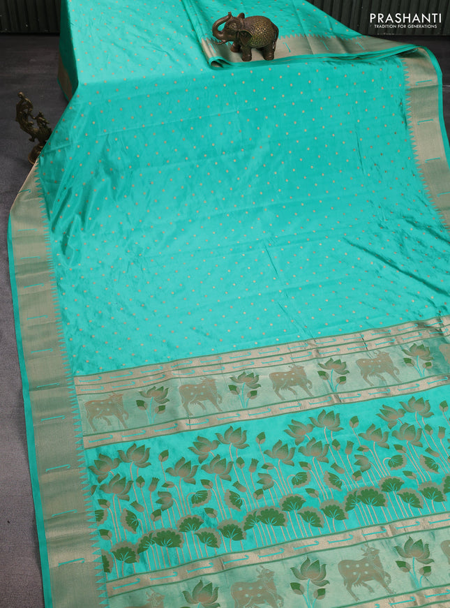 Semi raw silk saree teal green with allover zari woven buttas and pichwai design pallu