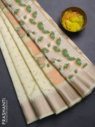 Semi raw silk saree cream with allover zari woven buttas and pichwai design pallu