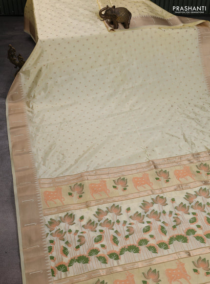 Semi raw silk saree cream with allover zari woven buttas and pichwai design pallu