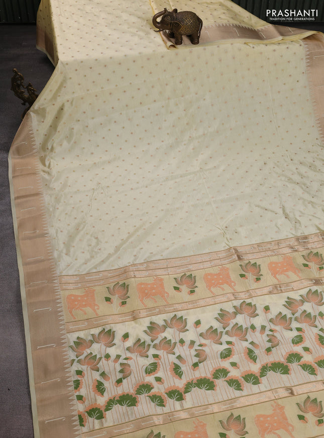 Semi raw silk saree cream with allover zari woven buttas and pichwai design pallu