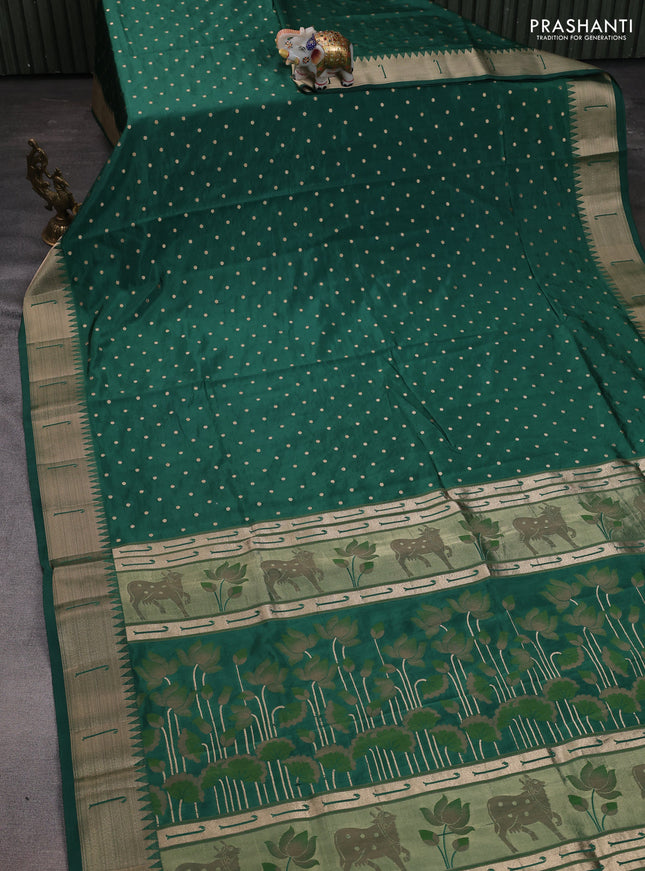 Semi raw silk saree green with allover zari woven buttas and pichwai design pallu