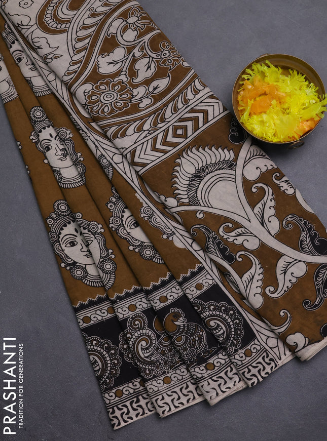 Kalamkari cotton saree dark mustard and black with allover prints and printed border