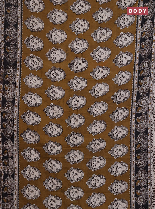 Kalamkari cotton saree dark mustard and black with allover prints and printed border