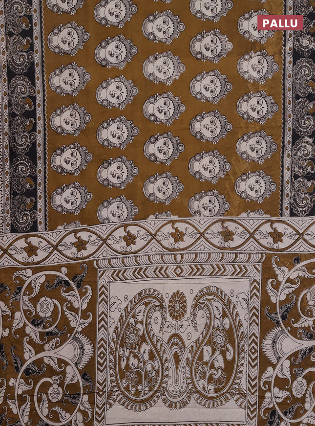 Kalamkari cotton saree dark mustard and black with allover prints and printed border