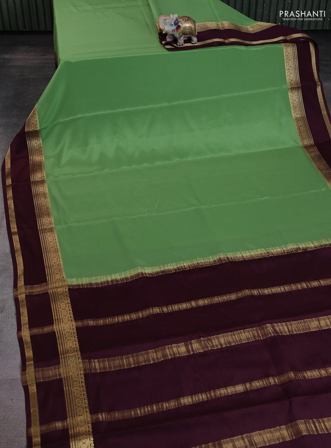 Pure mysore silk saree pista green and brown with plain body and rettapet zari woven border